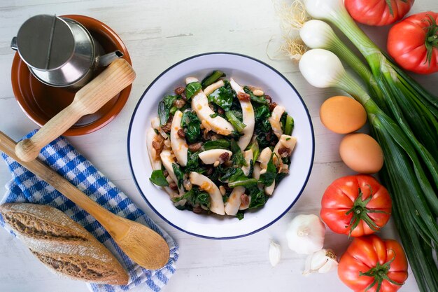 Cuttlefish cooked with chard and spinach spanish traditional tapas