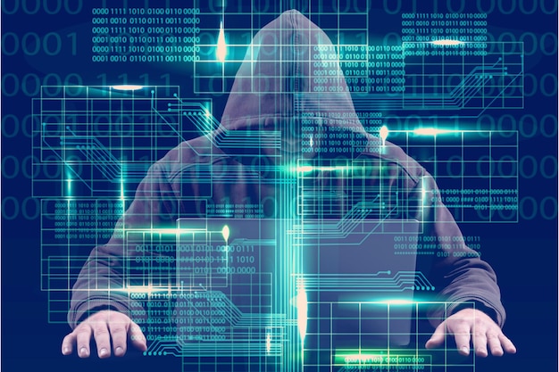 Cyber hacker using laptop on dark background