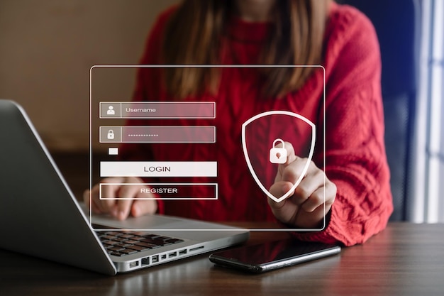 サイバー セキュリティの概念 ログイン ユーザー識別情報のセキュリティと暗号化 ユーザーの個人情報への安全なアクセス オフィスでスマートフォンとタブレットを使用する女性xAxA
