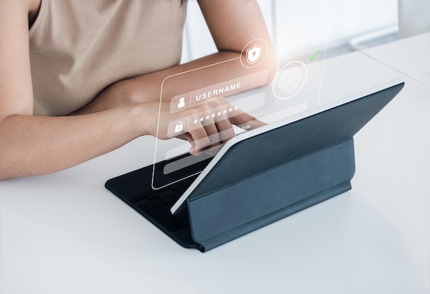 cyber security with biometrics authentication technology concept safety shield with finger scan icon on log in page virtual on tablet computer screen for validate password identity verification