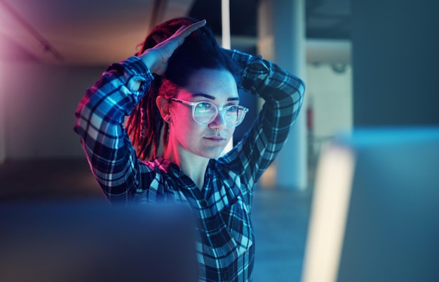 cybersecurity password and woman hacker getting ready while working on a computer at night for phishing database malware and ransomware with a female coder hacking a digital transformation network