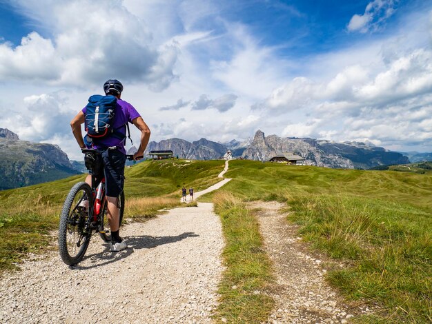 Photo cycling scene on the dolomites