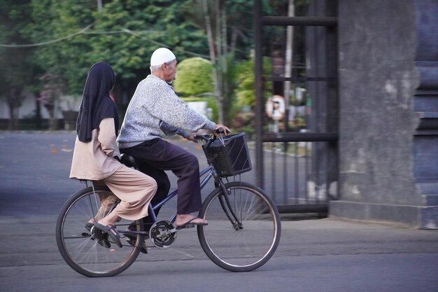 cycling with father and son on bicycle basket