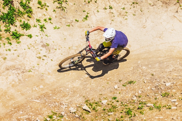 A cyclist descends from a mountain