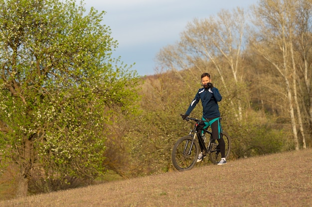 Cyclist rides through the woods