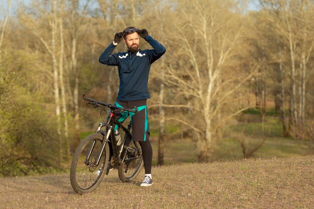 Cyclist rides through the woods