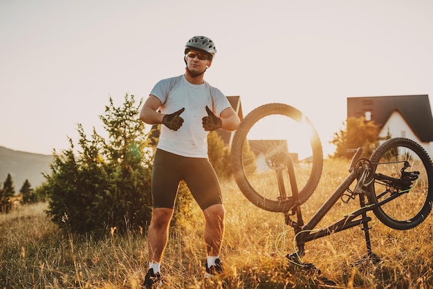 Cyclist riding the bike on the trail in the forest man cycling\
on enduro trail track sport fitness motivation and inspiration\
extreme sport concept selective focus highquality photo