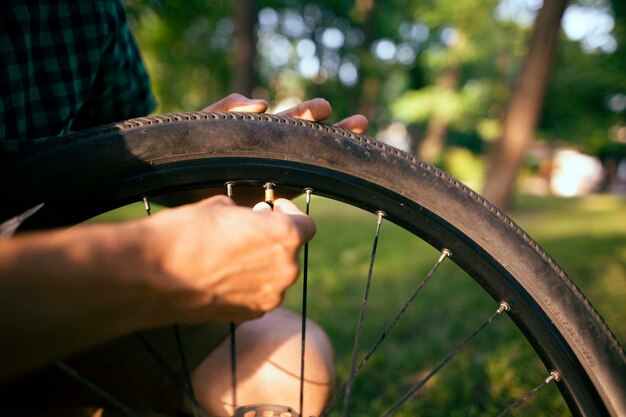cyclist riding in a city park.
