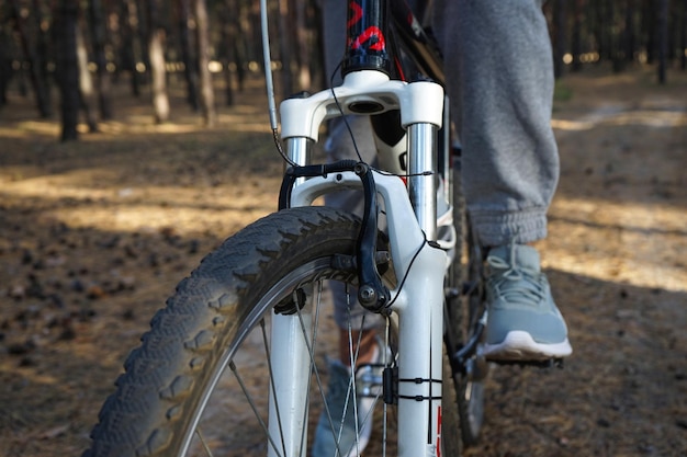 Cyclist riding a mountain bike in the forest closeup Mountain biking