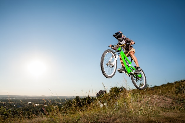 Cyclist with his bike in the mountain