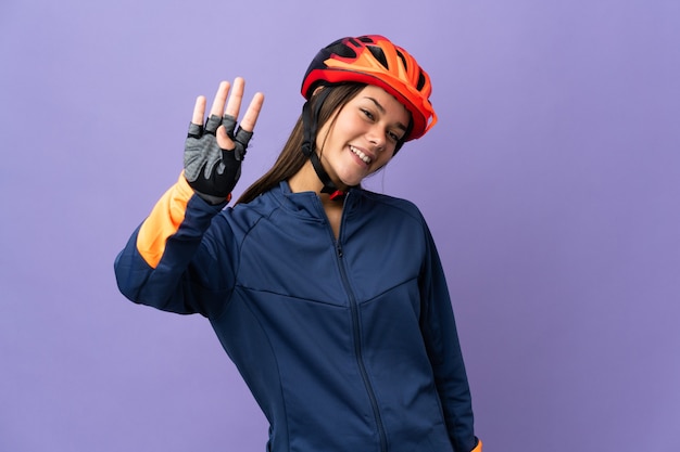 cyclist woman happy and counting four with fingers