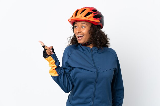 Cyclist woman isolated on white intending to realizes the solution while lifting a finger up