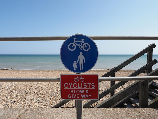 Cyclists slow and give way sign