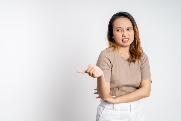 Cynical asian woman expression while standing over isolated background