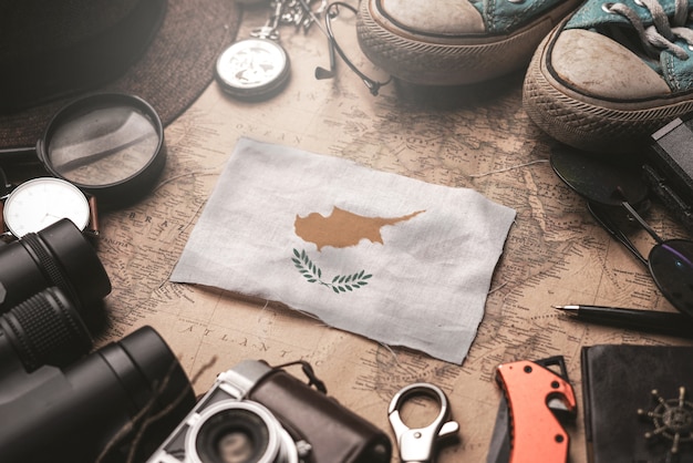 Cyprus Flag Between Traveler's Accessories on Old Vintage Map. Tourist Destination Concept.