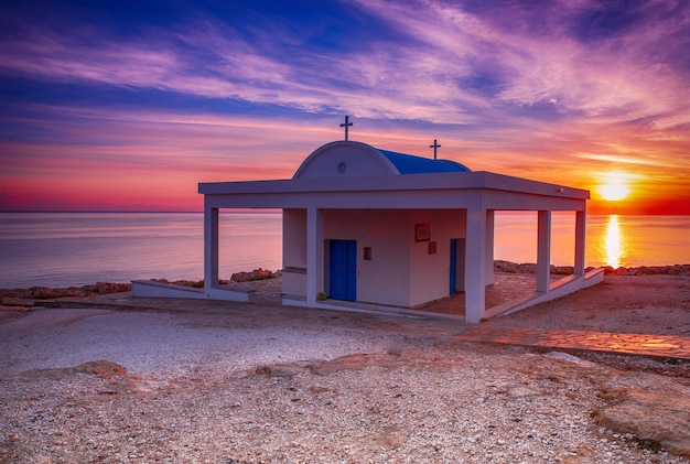 Cyprus, Mediterranean Sea coast. Agioi Anargyroi church at Cape Greco at sunrise