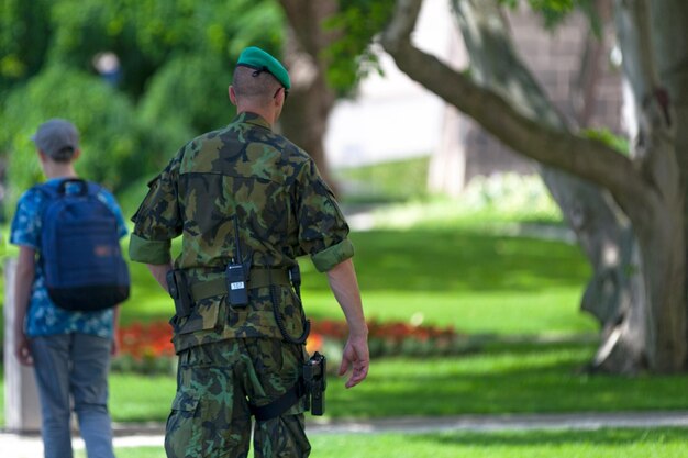 Czech soldier patrolling the park near hradcany castle