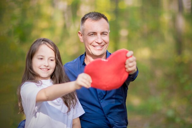 Dad and daughter with a red heart Father's Day