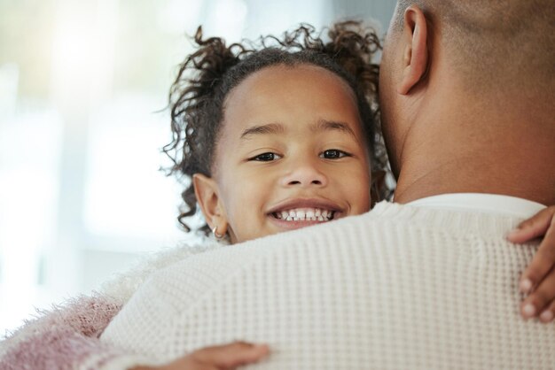 dad girl and hug in home portrait care and support in relationship for happiness father daughter and together in family house for love embrace and security for connection to single parent
