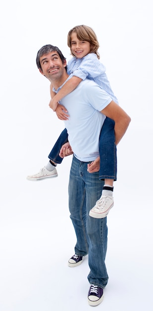 Dad giving son piggyback ride