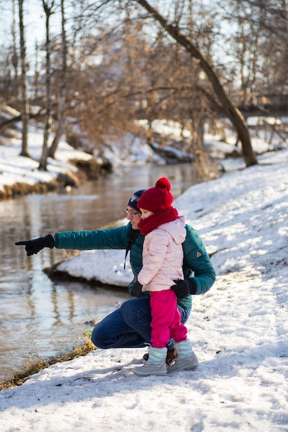 Dad shows daughter on spring creek