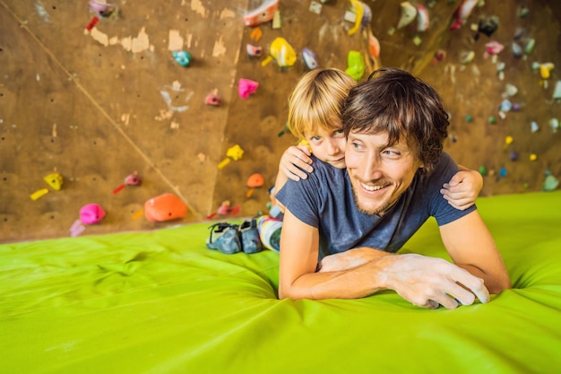 Dad and son at the climbing wall family sport healthy lifestyle\
happy family