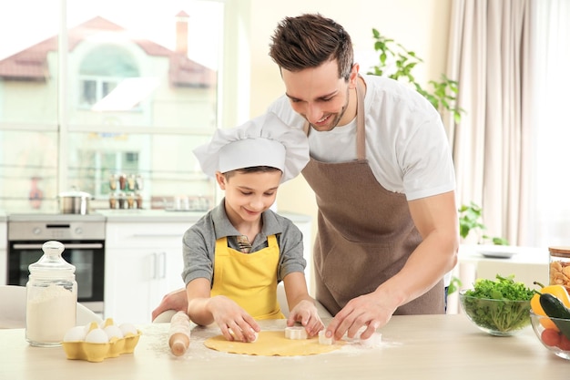 Dad and son cooking at home