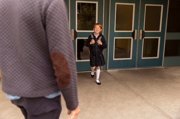 Dad walking his kid for first day of school