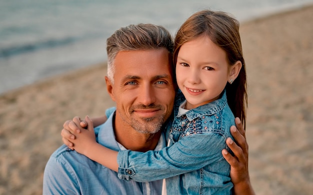 Dad with daughter on the beach