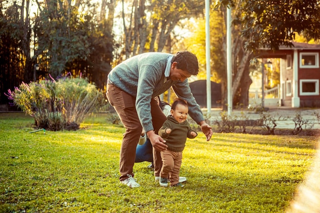 Dad with his little baby son in the park