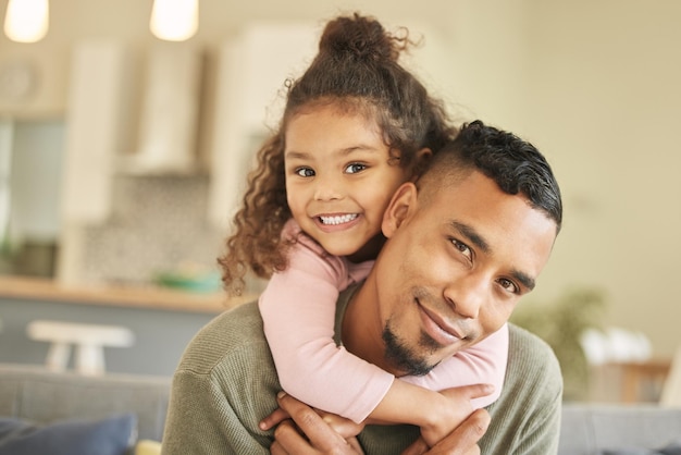 Dads the strongest Portrait of a young father and daughter bonding on the sofa at home