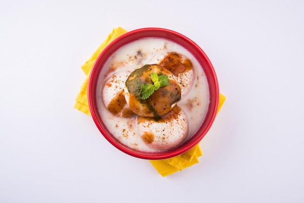 Dahi Vada or Dahi Bhalla also known as Curd Vadai in South India, Popular throughout India. Prepared by soaking lentil vadas in thick dahi or yogurt, topped with spicy &amp; sweet chutney