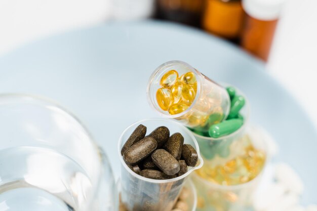 Daily intake capsules of vitamins and bads biologically active\
dietary supplements for healthcare pills and capsules of vitamins\
omega3 d and collagen