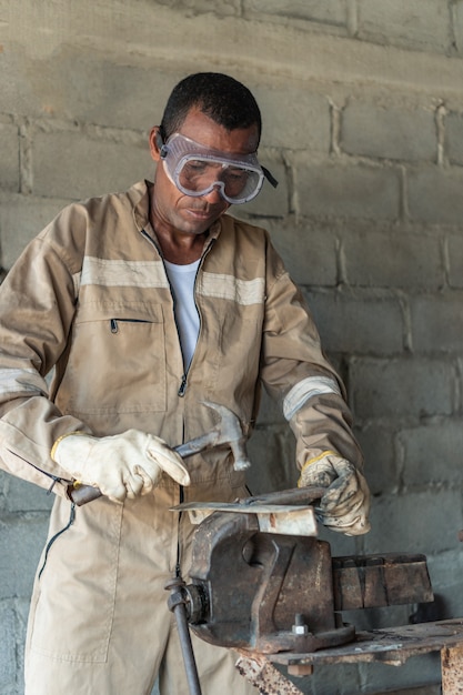 Daily working routine of professional welder at his workshop