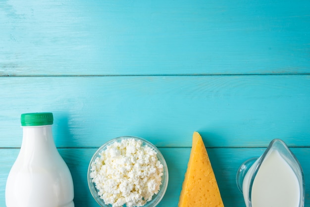 Dairy products on blue wooden table.