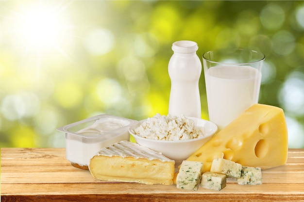 Photo dairy products collection on green light background