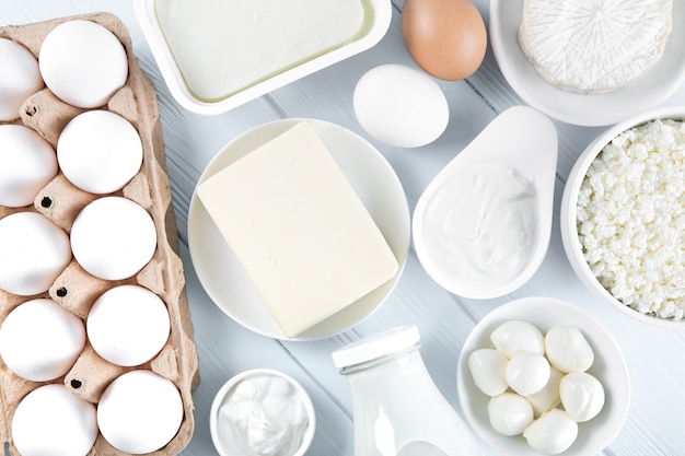 Dairy products and eggs on wooden table