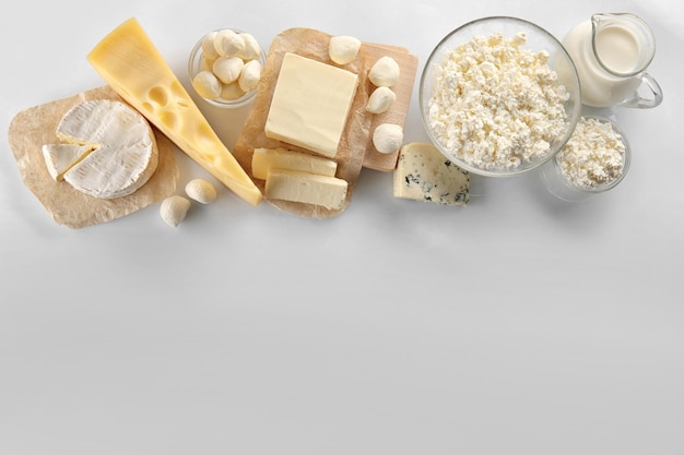 Dairy products on white background top view