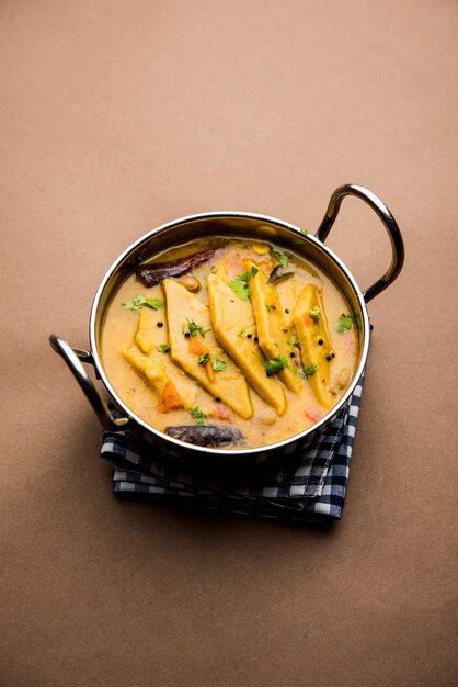 Dal Dhokli, Varan Phal or Chakolya is a gujarati, Rajasthani and maharashtrian dish made using diamond shape wheat flour cakes boiled in a dal. It's an easy one pot meal. served in a bowl.