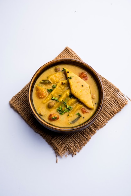 Dal Dhokli, Varan Phal or Chakolya is a gujarati, Rajasthani and maharashtrian dish made using diamond shape wheat flour cakes boiled in a dal. It's an easy one pot meal. served in a bowl.