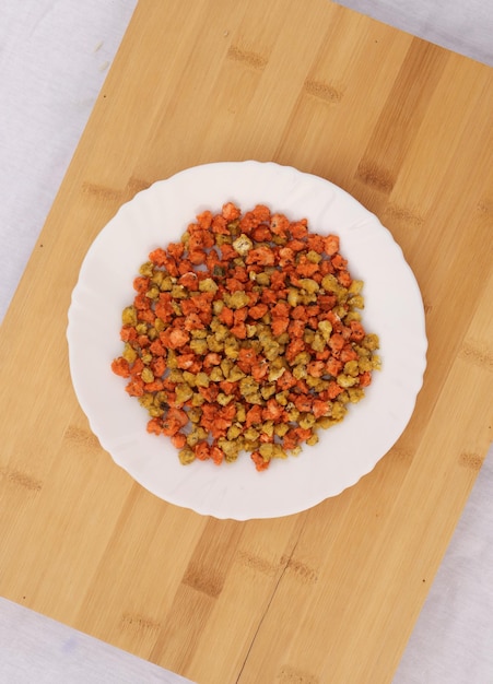 Dal ki Mithori on a White plate and wooden Background top view