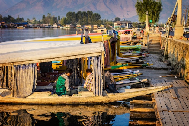 Dal lake at sunset time. Shikara boats on the water at Dal lake in the evening, Srinagar, Kashmir