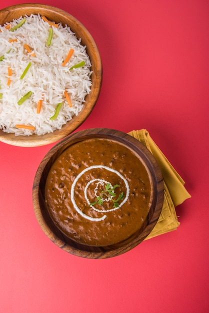 Dal Makhani or daal makhni, indian lunch or dinner item served with plain rice and butter Roti or Chapati or Paratha and salad