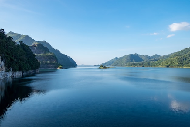 Dam blue water with mountain range clear