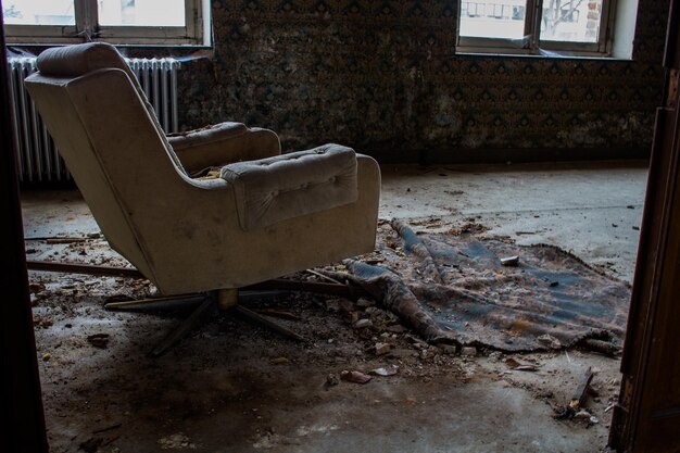 Damaged chair in abandoned room