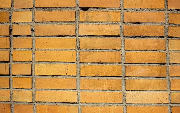 Damaged orange brickwork Orange brick horizontal dilapidated weathered Old brick wall