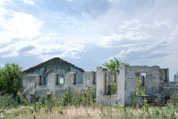 A damaged ruined building, destroyed settlement after war