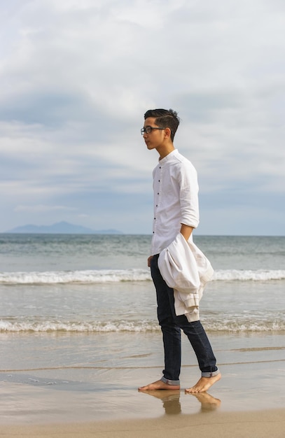 Danang, Vietnam - February 20, 2016: Young fellow in the China Beach of Danang in Vietnam