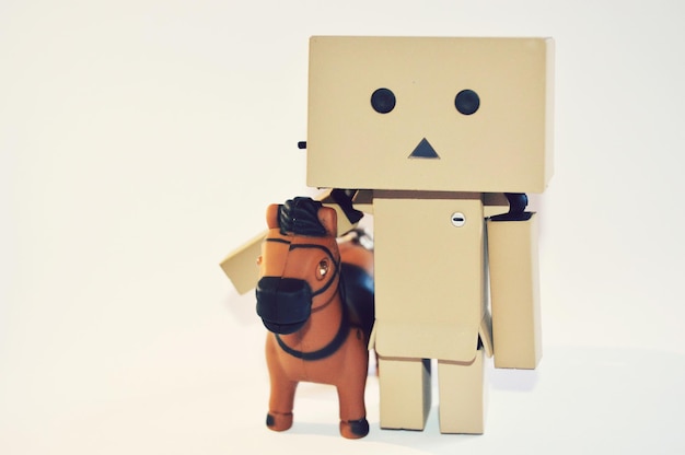 Photo danboard and toy horse against white background