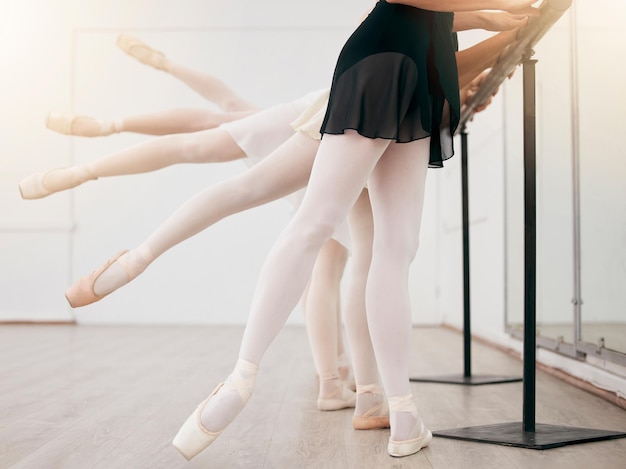 Dance fitness ballet girl students legs stretching with training exercise or workout in studio or theater school Ballerina health sport and dancing with teamwork in theatre show academy or class